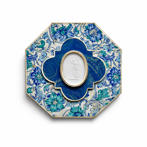 Decorative plate with blue floral design on a white background