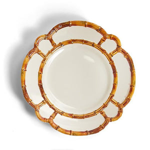 Four decorative plates with brown rattan-like rim on a white background