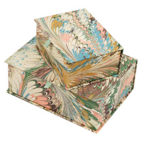 Marbled paper book with colorful patterns on a white background