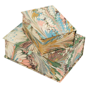 Marbled paper book with colorful patterns on a white background