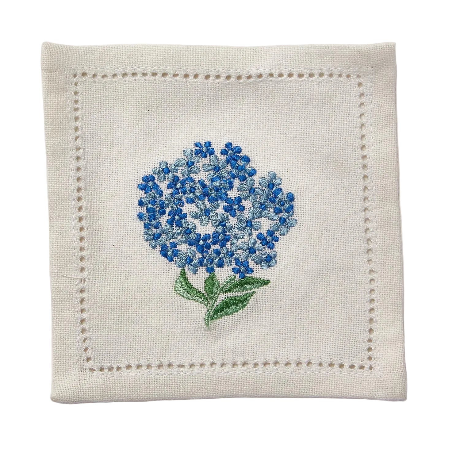 Embroidered blue flower on a beige fabric square