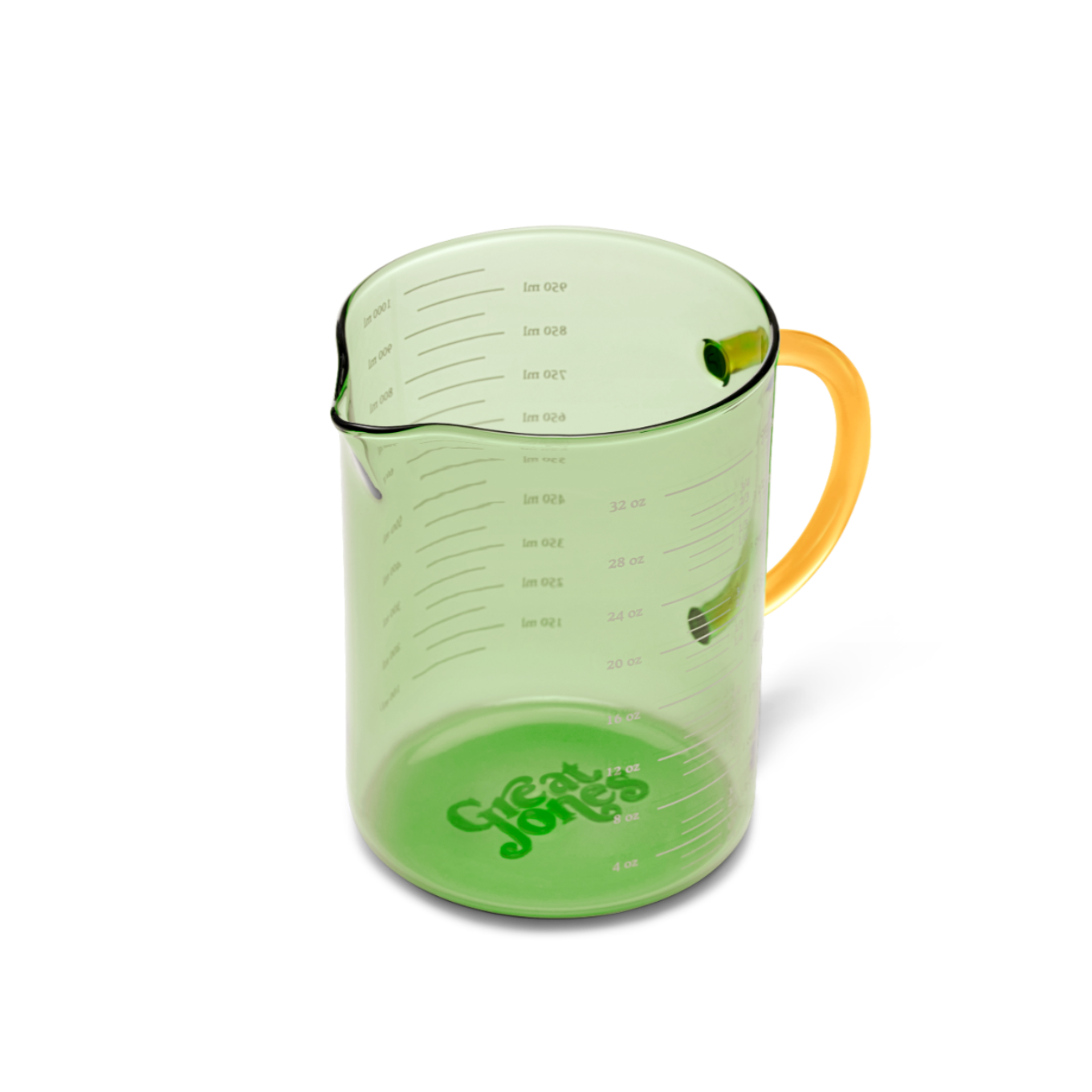 Green measuring cup with yellow handle on a white background
