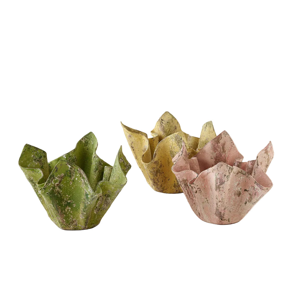 Three decorative stone cups in green, yellow, and pink on a white background