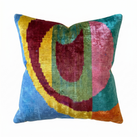 Multicolored pillow with circular pattern on a white background
