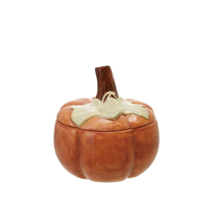 Pumpkin-shaped container with a lid on a white background