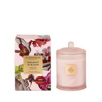Pink candle with decorative packaging on a white background